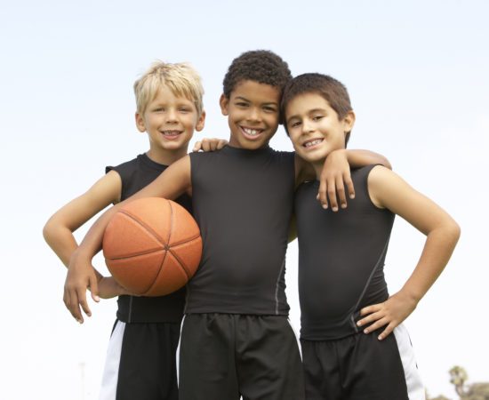 Young Boy Playing Basketball